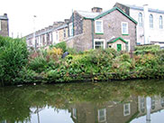 Stone terraced housing and industry on the canal bank