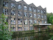 Old stone built mill or warehouse in need of refurbishment