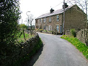 A row of stone cottages in the middle of nowhere