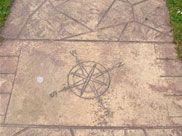 Compass directions etched into towpath