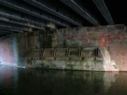 Underneath the railway bridge, evidence of widening