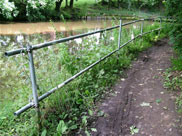 Scaffolding fence along towpath