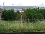 Blackburn End stand of Ewood Park visible from the towpath