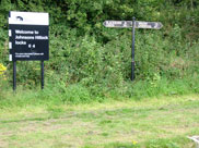Signpost and milage markers at the bottom lock