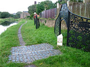 A pipe in the towpath marks the halfway point